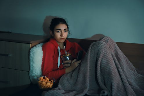 Girl watching TV at home