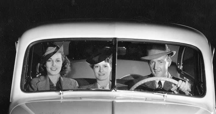 1939 Oldsmobile driver and female passengers. Creator: Unknown. (Photo by National Motor Museum/Heri...