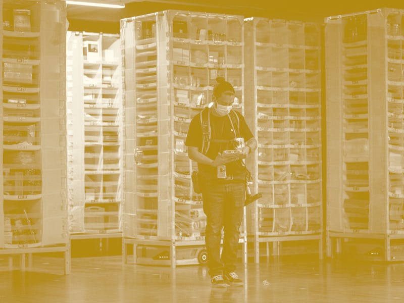 EASTVALE, CA - AUGUST 31: Amnesty technician Gustavo Morales controls logistics robots at Amazon ful...