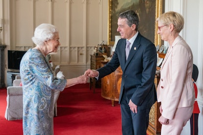 Britain's Queen Elizabeth II greets Switzerland's President Ignazio Cassis (C) and his wife Paola Ca...