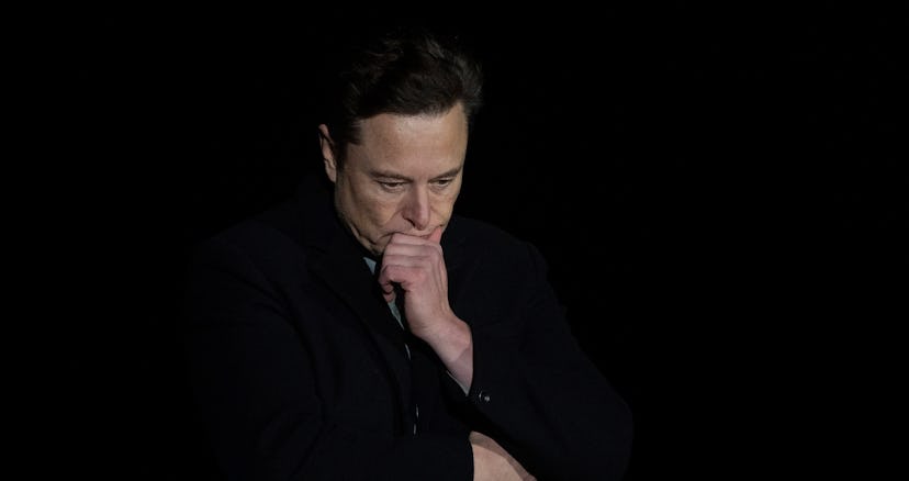 Elon Musk pauses and looks down as he speaks during a press conference at SpaceX's Starbase facility...