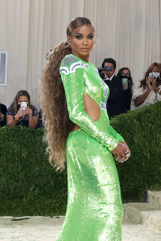 Ciara honey blonde hair color in glittery Seahawks dress at Met Gala 2021