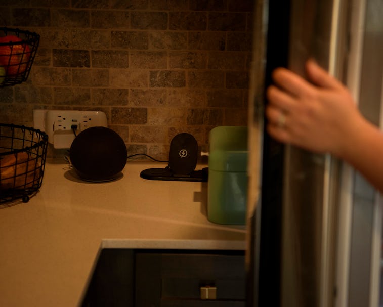 PEARLAND, TEXAS - DECEMBER 17: An Amazon Alexa sits next to the refrigerator at the home of Mary Ves...