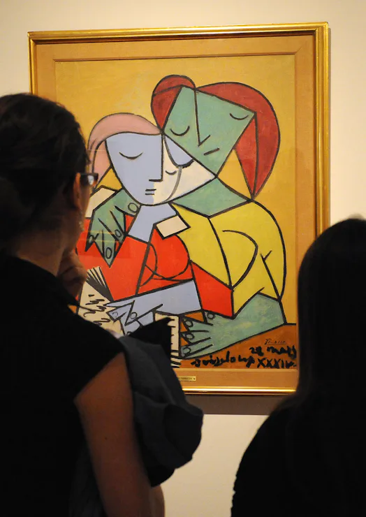 Visitors look at "Two girls reading" by cubist master Pablo Picasso during the "Picasso 1917-1937: T...