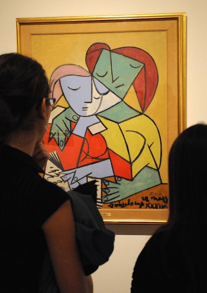 Visitors look at "Two girls reading" by cubist master Pablo Picasso during the "Picasso 1917-1937: T...
