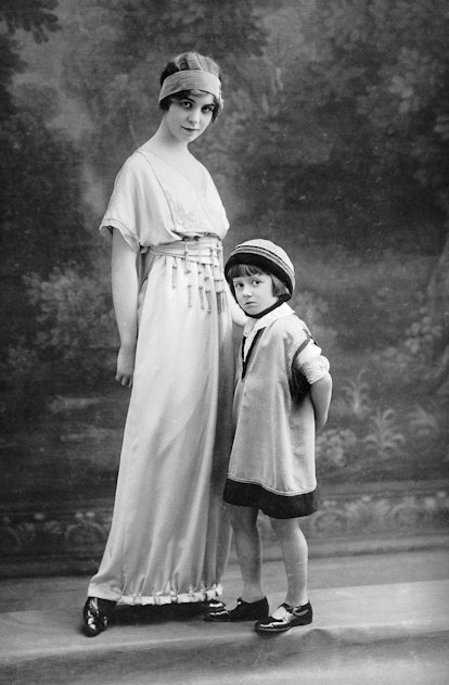 FRANCE - JANUARY 01:  This woman and child are modeling two dresses from the LANVIN fashion house ty...