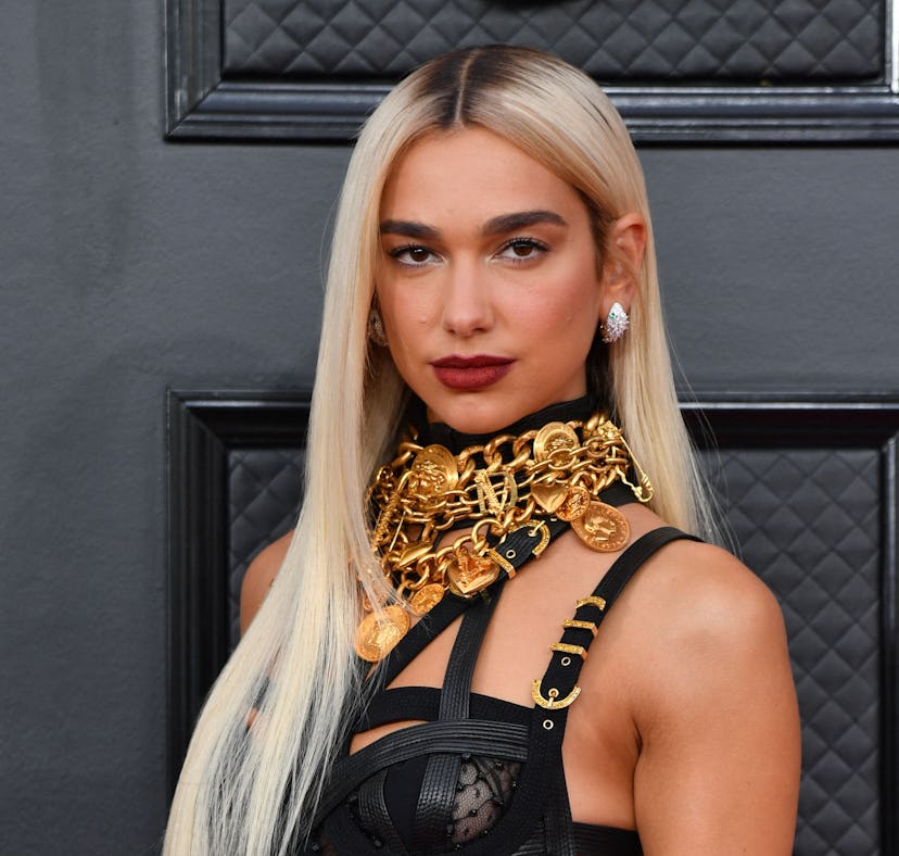 Dua Lipa wearing Versace on the Grammys 2022 red carpet.