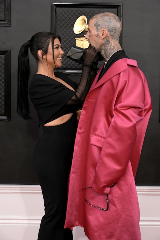 Kourtney Kardashian and Travis Barker's body language at the 2022 Grammys was intimate.