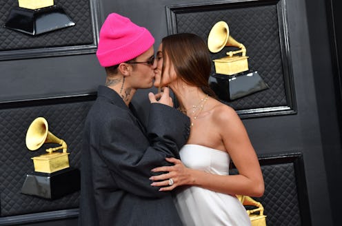 Canadian singer-songwriter Justin Bieber (L) and US model Hailey Bieber arrive for the 64th Annual G...