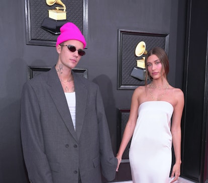 LAS VEGAS, NEVADA - APRIL 03: (L-R) Justin Bieber and Hailey Bieber attend the 64th Annual GRAMMY Aw...