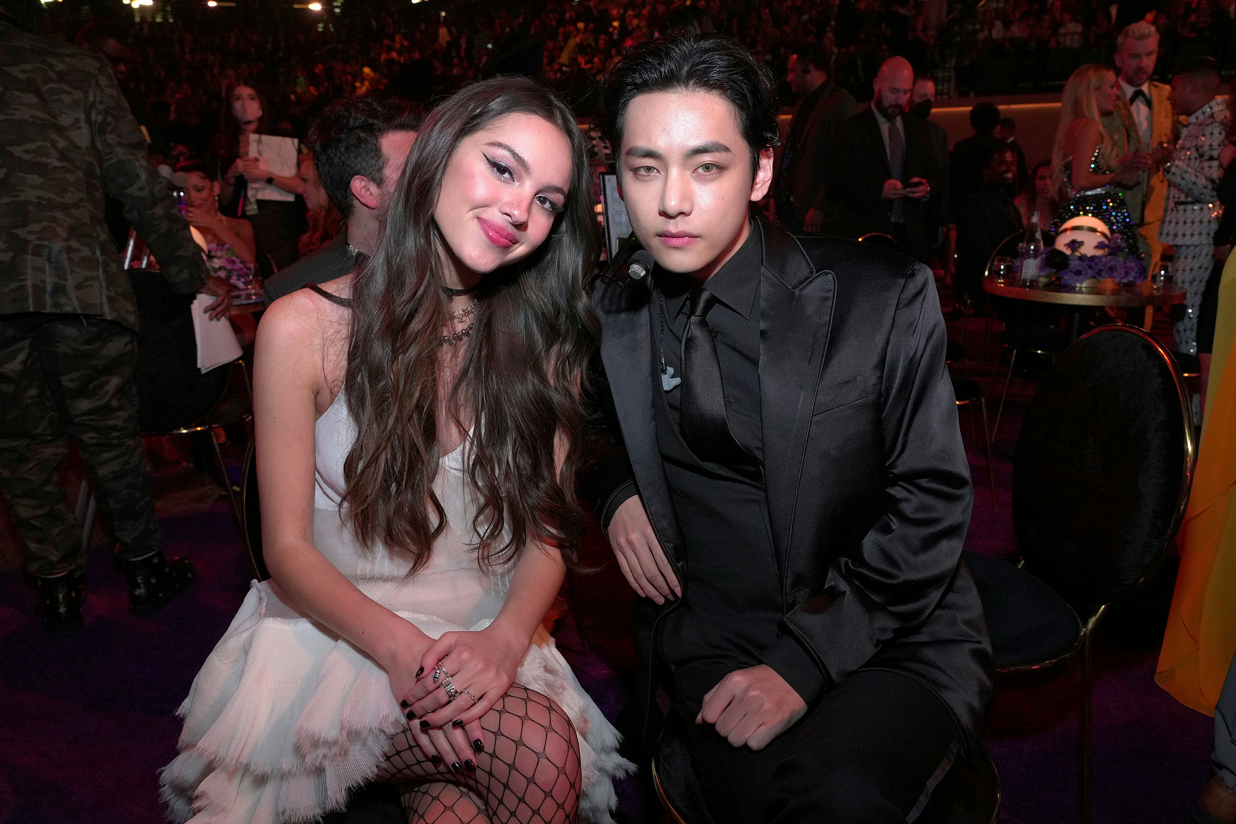 BTS' V and Olivia Rodrigo at the 2022 Grammys.