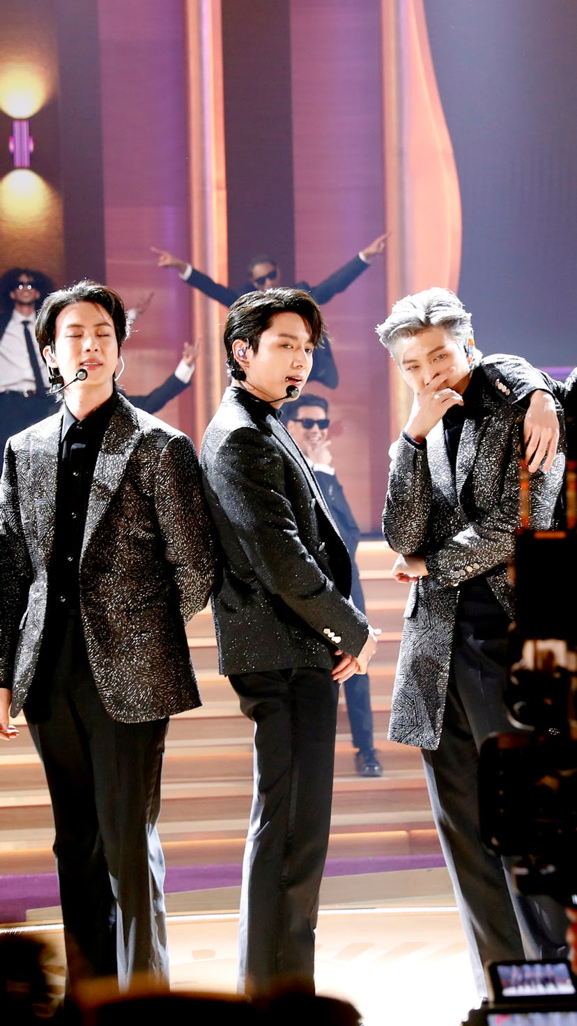 Jimin, J-Hope, Jin, Jungkook, RM, Suga, and V of BTS perform at the Grammys