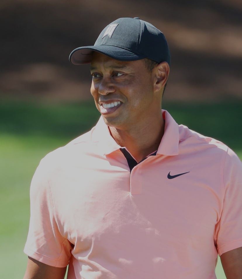 AUGUSTA, GEORGIA - APRIL 03: Tiger Woods of the United States warms up in the practice area prior to...