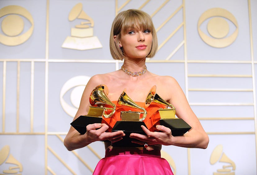 Taylor Swift poses in the press room at the The 58th GRAMMY Awards at Staples Center on February 15,...