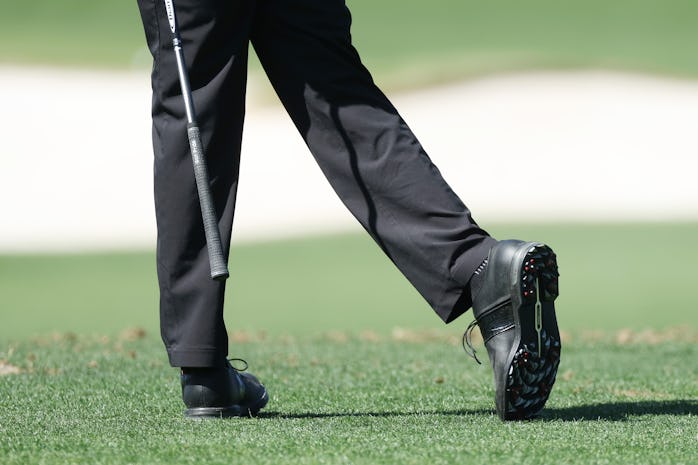 AUGUSTA, GEORGIA - APRIL 03: A detail of the shoes of Tiger Woods of the United States as he warms u...