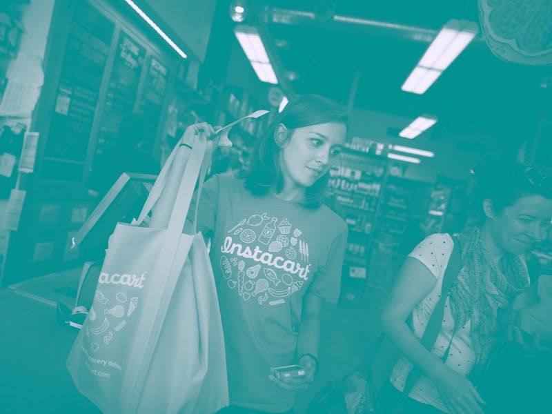 Instacart personal shopper, Sydney Hollingsworth, carries a customer's order after purchasing it at ...