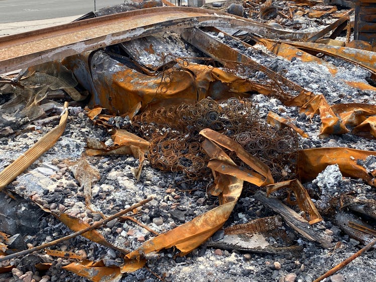 Louisville CO USA. March 26, 2022:  Remnants of homes and vehicles are see in the ash and debris fro...