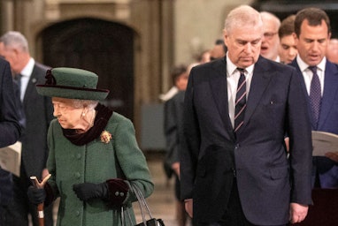 Britain's Queen Elizabeth II (L) and her son Britain's Prince Andrew, Duke of York, attend a Service...