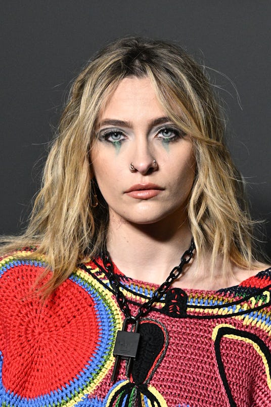 Paris Jackson at the Givenchy Womenswear Fall/Winter 2022/2023 with grey eyeshadow and eyeliner in h...