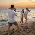 Group of happy friends taking selfie and having fun with beach sport games - Summer joy concept and ...