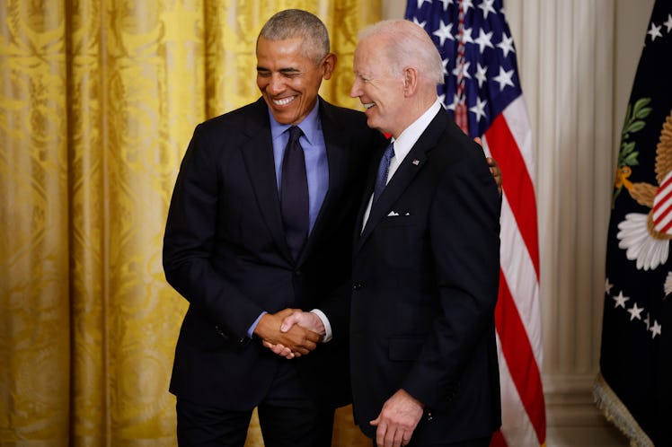 WASHINGTON, DC - APRIL 05: Former President Barack Obama (L) and U.S. President Joe Biden shake hand...