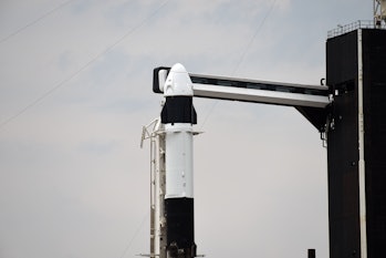 CAPE CANAVERAL, FL - APRIL 7: A SpaceX Dragon spacecraft sits atop a Falcon 9 rocket on launch Pad 3...