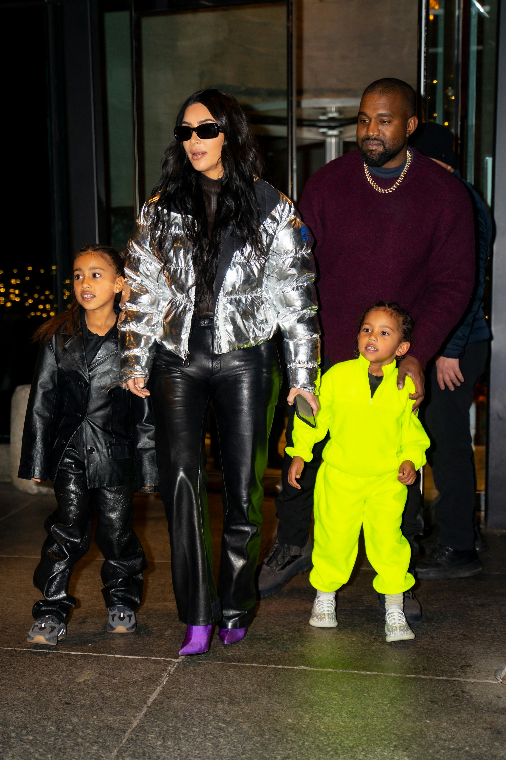 NEW YORK, NEW YORK - DECEMBER 21: (L-R) North West, Kim Kardashian, Kanye West and Saint West are se&hellip;