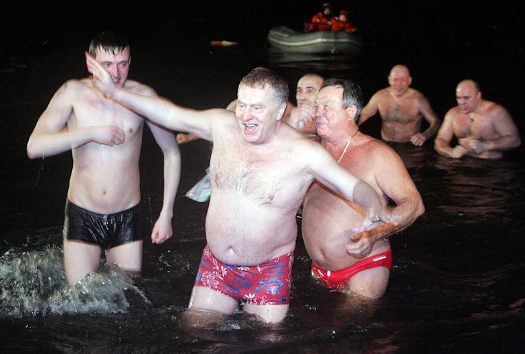 Russian liberal-democratic party leader Vladimir Zhirinovsky enters a pond in Moscow after the Orth...