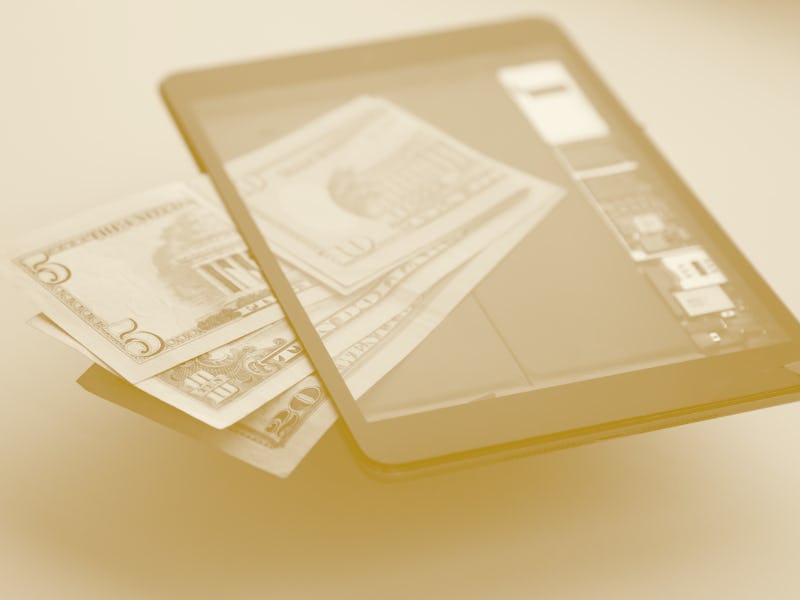 Online Working Concept. Modern Technology. E-Commerce. World Trading. US Paper Currency Inside Of Di...