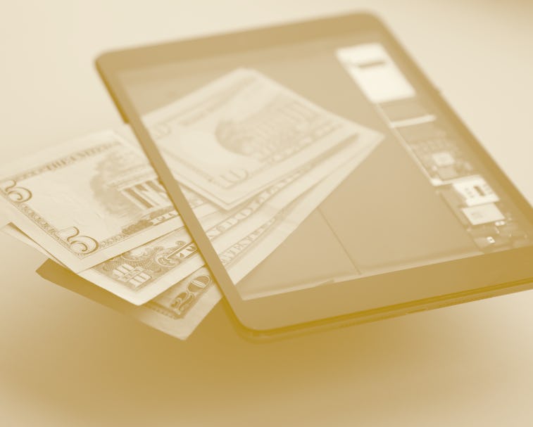 Online Working Concept. Modern Technology. E-Commerce. World Trading. US Paper Currency Inside Of Di...