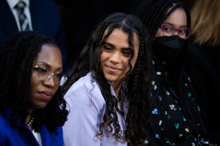 Supreme Court Judge Ketanji Brown Jackson sits with her daughters Talia (right) and Leila (center) d...