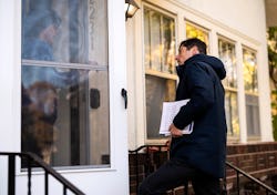 MINNEAPOLIS, MN - NOVEMBER 02: Minneapolis mayor Jacob Frey speaks with a resident while campaigning...