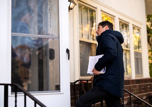 MINNEAPOLIS, MN - NOVEMBER 02: Minneapolis mayor Jacob Frey speaks with a resident while campaigning...