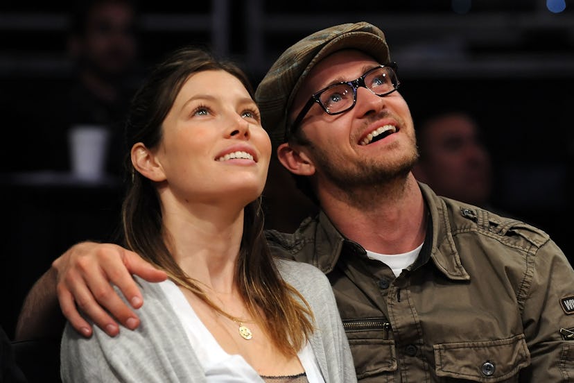 LOS ANGELES, CA - APRIL 21: Actors Jessica Biel and Justin Timberlake smile from their courtside se…