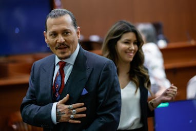 Actor Johnny Depp stands in the courtroom during a recess amid his defamation trial against his ex-w...
