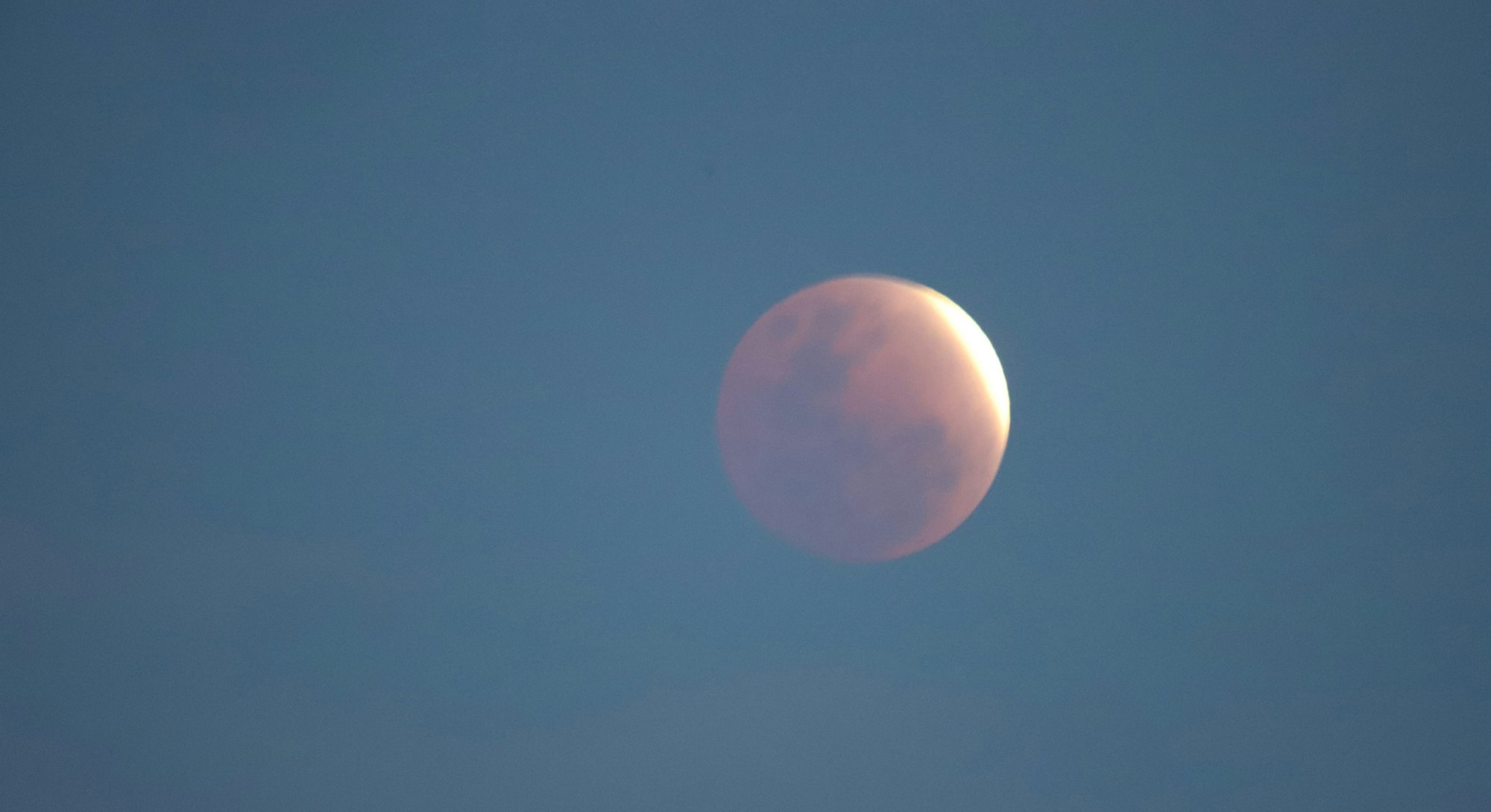 Close up of the full lunar eclipse. The May full flower moon lunar eclipse 2022 peaks on May 15.