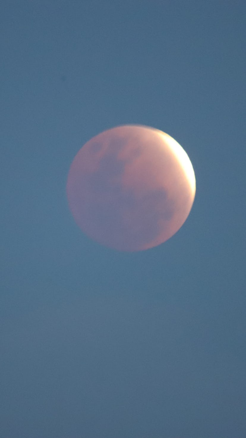 Close up of the full lunar eclipse. The May full flower moon lunar eclipse 2022 peaks on May 15.