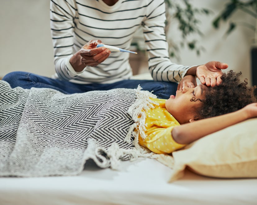 A mom takes care of her sick child at home as the flu is circulating right now.