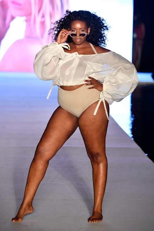 A plus size model in a TikTok summer trending bikini walked the runway for the 2018 Sports Illustrat...