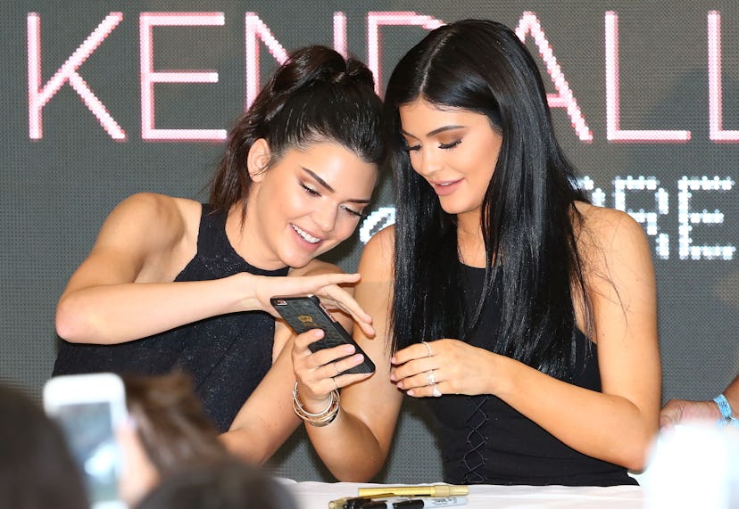 MELBOURNE, AUSTRALIA - NOVEMBER 18:  Kylie Jenner takes a selfie on her phone as Kendall Jenner and ...