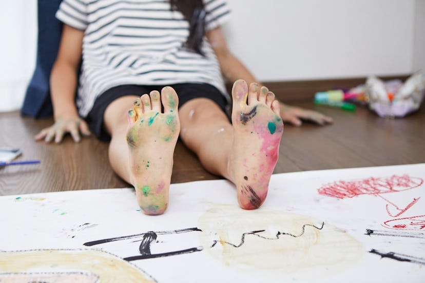 The sole of a kids' foot, colorfully stained with paint, Instagram captions for pictures of your kid...