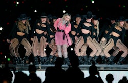 Pop icon Madonna (C) performs on stage with Colombian singer Maluma (out of frame) during his concer...