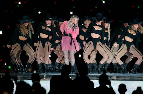 Pop icon Madonna (C) performs on stage with Colombian singer Maluma (out of frame) during his concer...
