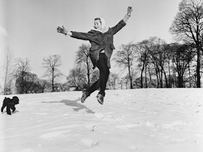 English actress and singer Millicent Martin cavorting in the snow, UK, 9th January 1963.  (Photo by ...