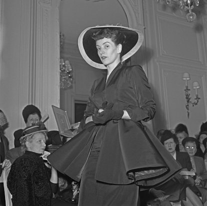 An unspecified model wearing a Christian Dior design at the designer's Summer 1948 fashion show in P...