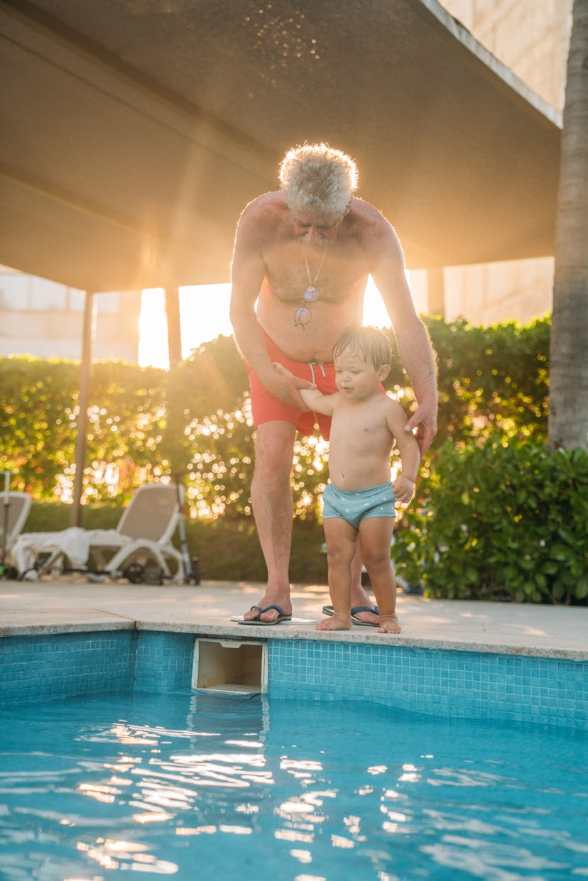 Grandpa and grandson on a swimming pool side, instagram captions for pictures of your kid's first ti...