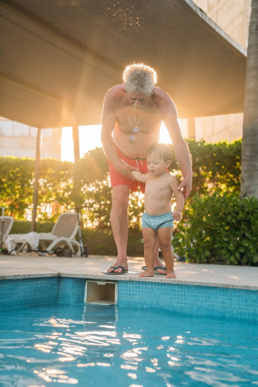 Grandpa and grandson on a swimming pool side, instagram captions for pictures of your kid's first ti...