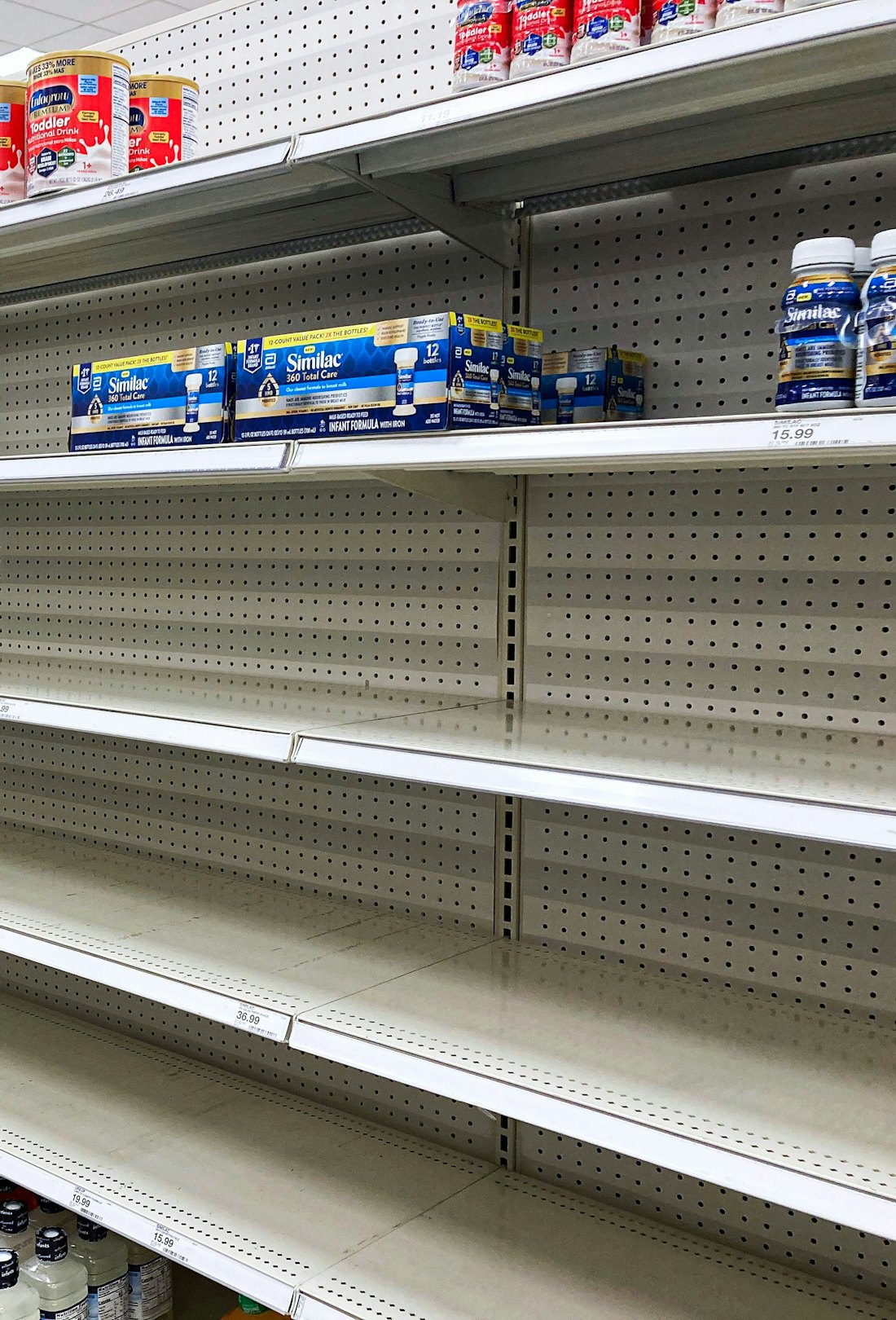 A nearly empty baby formula display shelf is seen at a Target store in Orlando.