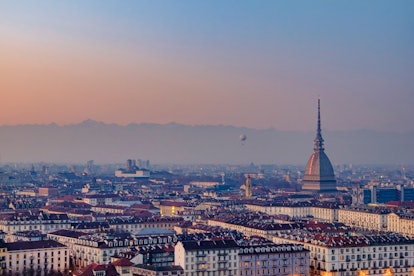 Sunset over Turin with the Mole Antonelliana in background. Italy