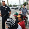 Los Angeles, CA - October 24: Sgt. Charles Coleman of the LAPD Foothill Division speaks with Claranc...